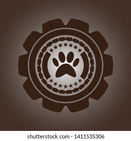 paw icon inside wooden emblem. Vintage.