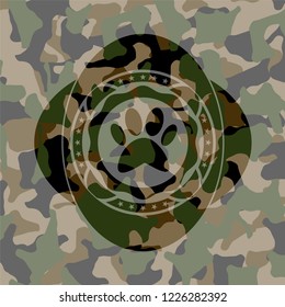 paw icon on camouflaged pattern