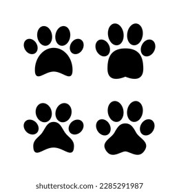 Paw icon vector illustration. paw print sign and symbol. dog or cat paw