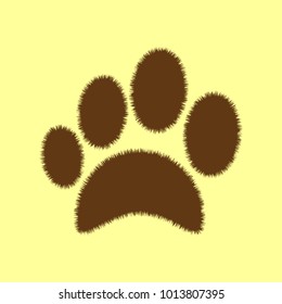 Paw icon. Veterinary or pet shop emblem. Vector. Brown hairy icon on yellowish background. Isolated.