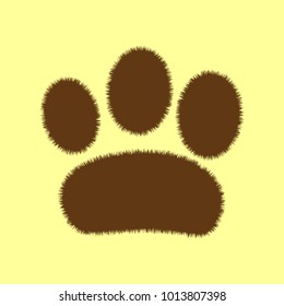 Paw icon. Veterinary or pet shop emblem. Vector. Brown hairy icon on yellowish background. Isolated.