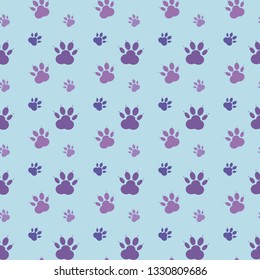 Paw pattern, seamless vector pattern silhouettes of paw, cat's feet, dog's footprint. Purple on blue background