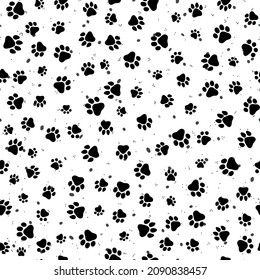 Paw print seamless pattern. Abstract black and white spots, dots and cat paw trails. Textured monochrome vector repeat design