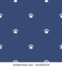 Paw print seamless pattern. White pawprint on blue background. Design for textile, wallpaper, fabric. Pet care symbol. Vector repeat ornament