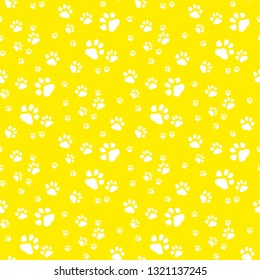 Paw print seamless pattern yellow background.