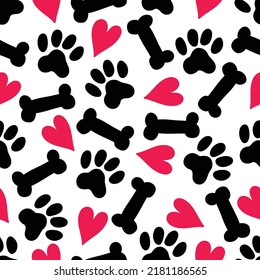 Paw prints, bones, hearts. Funny children's seamless pattern. Can be used in textile industry, paper, background, scrapbooking.Vector.