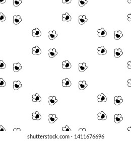 The paw prints of a cat. Seamless pattern. Vector illustration.