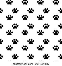 Paw prints pattern vector illustration. Seamless background with black paw prints.