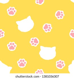 Paw seamless pattern. hand drawn with  footprint and head cat, cute animal on yellow background. Vector illustration