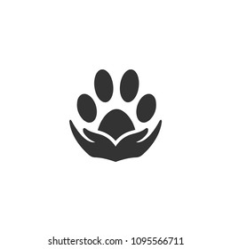 Paw silhouette in circle shape and hand