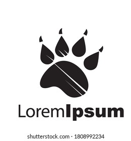 Paw Silhouette In Circle Shape And Hand Logo  Dogs.