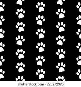 Paw symbol seamless pattern on black background. Vector illustration.