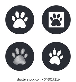 Paw  - vector icon in white  on a black background.