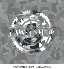 Pawn Shop written on a grey camouflage texture