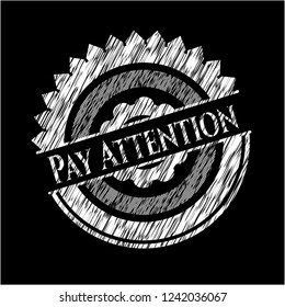 Pay Attention chalk emblem written on a blackboard