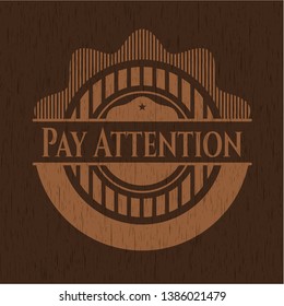 Pay Attention retro wood emblem. Vector Illustration.