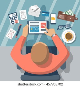 Pay bills online. Online payment on internet concept. Flat design style vector illustration. Credit card, digital tablet, bill.  Man at desk with a tablet.