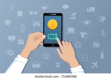Payment by Bitcoins. Pay for goods and services by crypto currency. Payment service international transfers by electronic virtual currency. Hands holding a phone with a gold coin bitcoin. Vector 