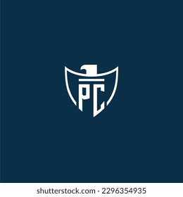 PC initial monogram logo for shield with eagle image vector design