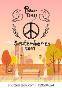 Peace Day 2017 September 21 emblem. Vector illustration of hippie logo surrounded by flying doves and spikelets. Autumn city park is on background