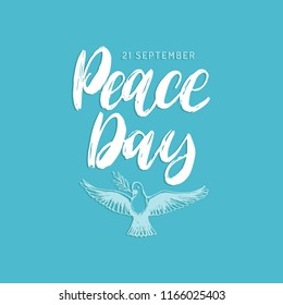 Peace Day, vector hand lettering. Drawn illustration of dove with a palm branch on blue background. Holiday card, poster with calligraphy.