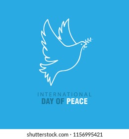 Peace dove with olive branch on blue sky background