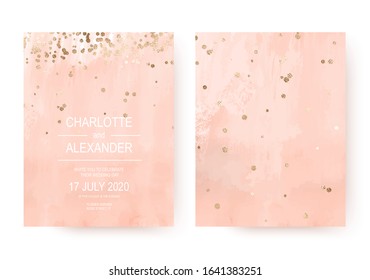 Peachy acrylic wedding invitation cards with gold border confetti.