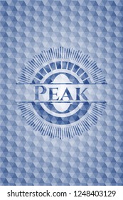 Peak blue emblem or badge with abstract geometric polygonal pattern background.