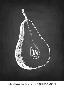 Pear cut in half. Chalk sketch on blackboard background. Hand drawn vector illustration. Retro style.