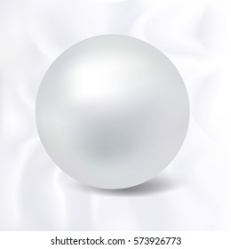 Pearl  bead with shadow on silky background.