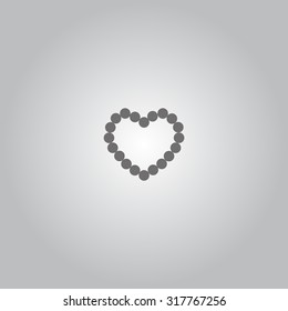 Pearl beads as heart on a white background