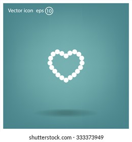 Pearl beads as heart on a white background
