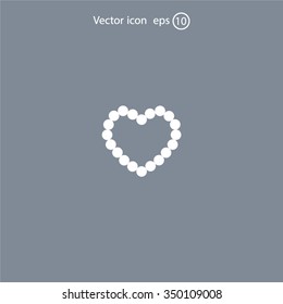 Pearl beads as heart on a white background