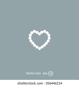 Pearl beads as heart on a white background