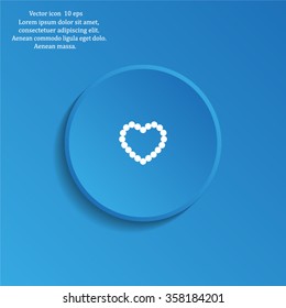Pearl beads as heart on a white background
