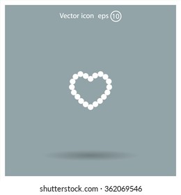 Pearl beads as heart on a white background