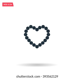 Pearl beads as heart on a white background