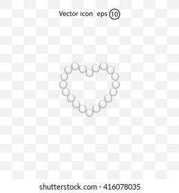 Pearl beads as heart on a white background