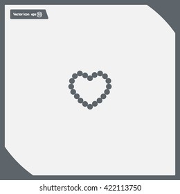 Pearl beads as heart on a white background