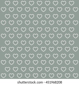 Pearl beads as heart on a white background