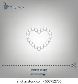 Pearl beads as heart on a white background