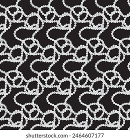 Pearl necklace on a black background. Seamless pattern. 
