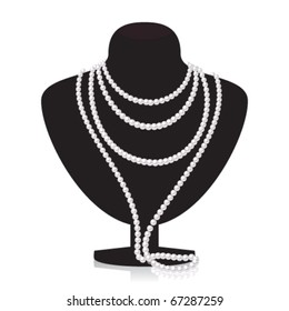 Pearl necklace on black mannequin isolated on a white background