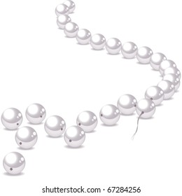 Pearl necklace and scattered pearls on a white background