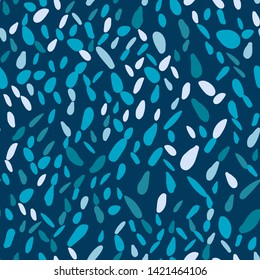 Pebble seamless pattern on blue background. Abstract geometric dotted wallpaper. Random stones backdrop. Vector illustration