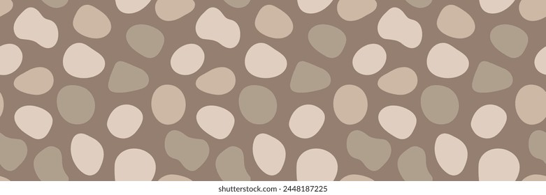 Pebble stone vector seamless pattern. Organic shape blobs in neutral brown colors. Bohemian seamless earth tone rounded cobblestone shapes repeat texture. Boho style aesthetic minimal gravel backdrop