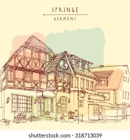 Pedestrian street in a small town in Germany, Europe. Traditional old German fachwerk historical buildings. Vintage tourist postcard or poster