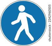 Pedestrian zone sign. Mandatory sign. Round blue sign. Crosswalk. Only foot traffic. Entrance. Follow traffic rules. Road sign.