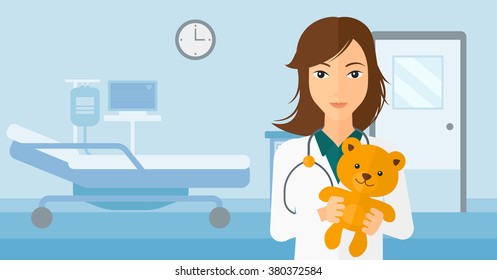 Pediatrician holding teddy bear.