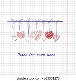 pen drawing hanging hearts on copybook page